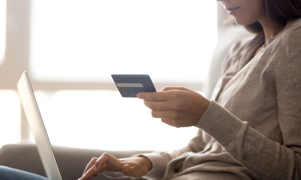 Woman holds credit card