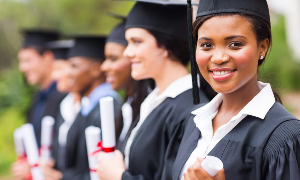 College students hold diplomas