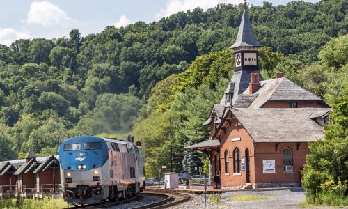 Amtrak train goes by scenic station