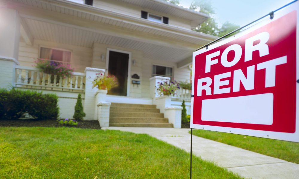 For Rent sign in front of house