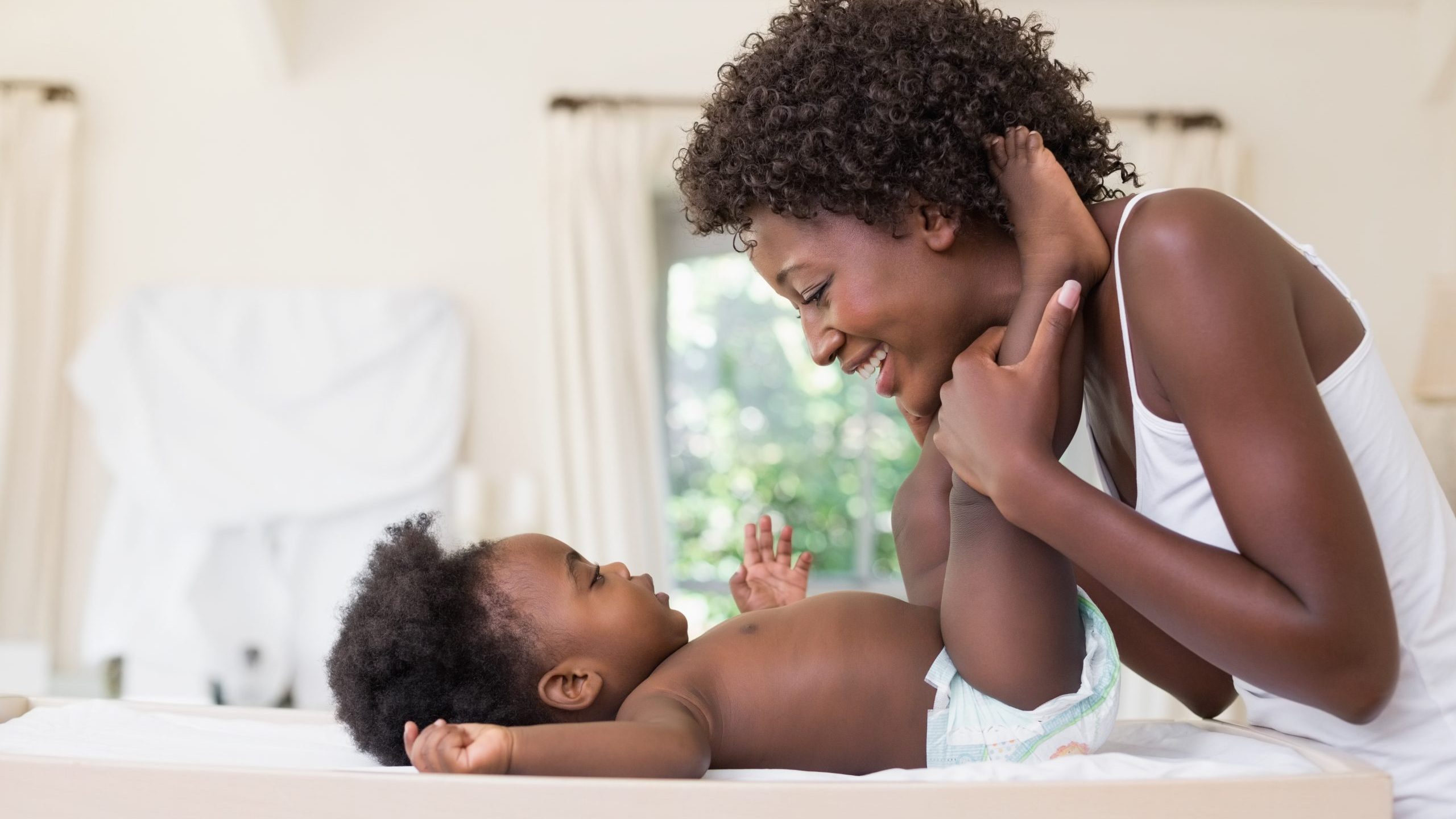 Mom and baby on diaper changing table