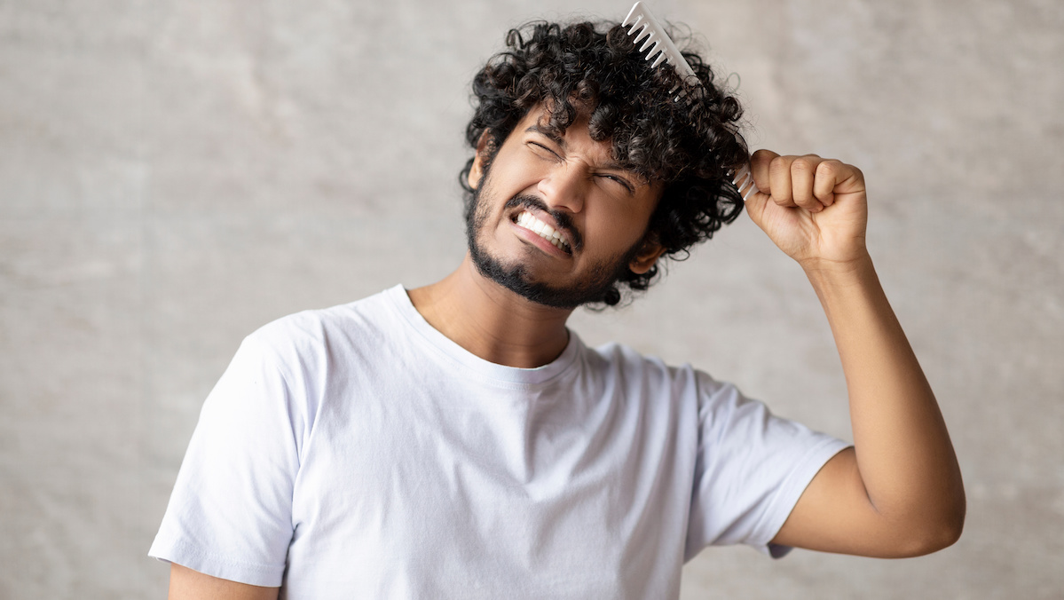 Indian man with matted curly hair