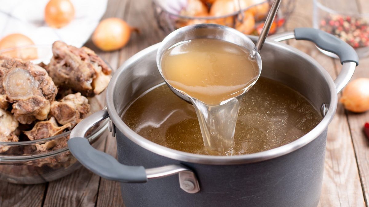 Saucepan with bone broth simmering.