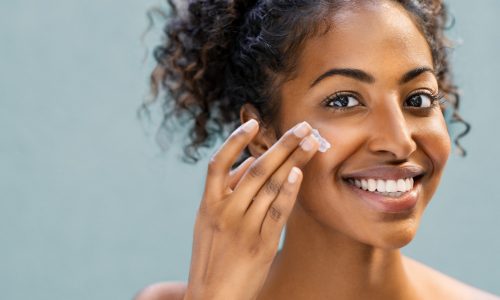 Woman uses facial moisturizer