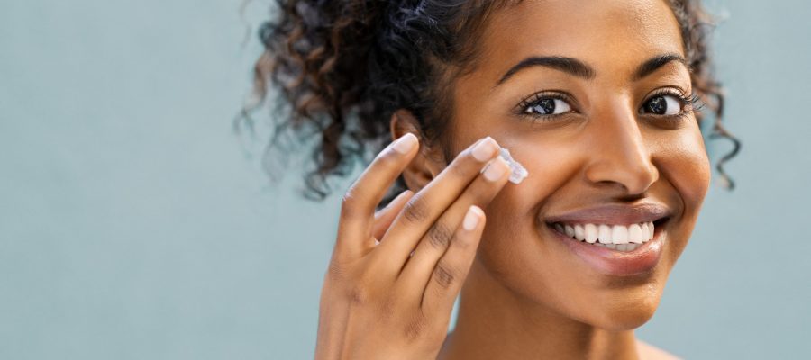 Woman uses facial moisturizer