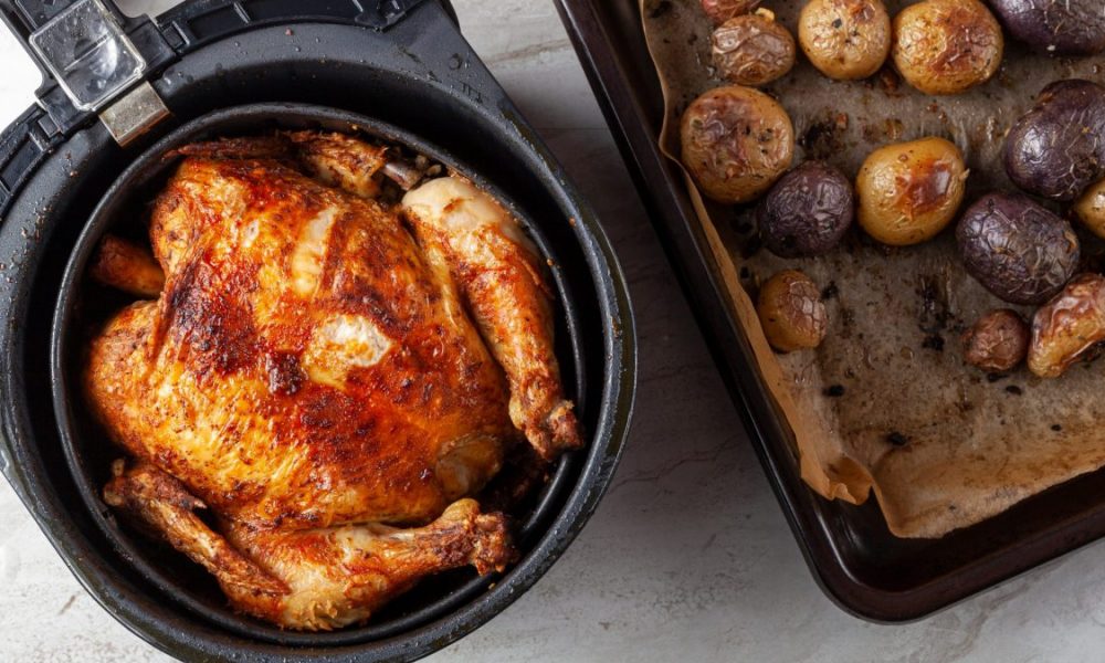 A whole chicken cooked inside an air frier