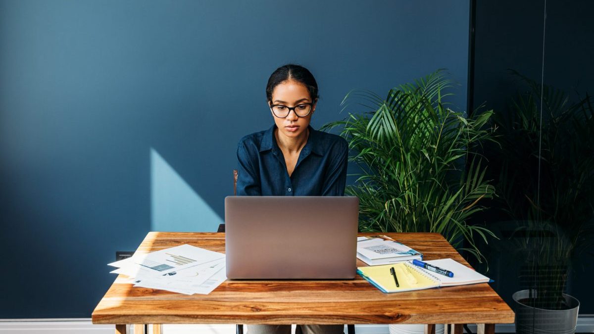 Serious woman sitting at a table