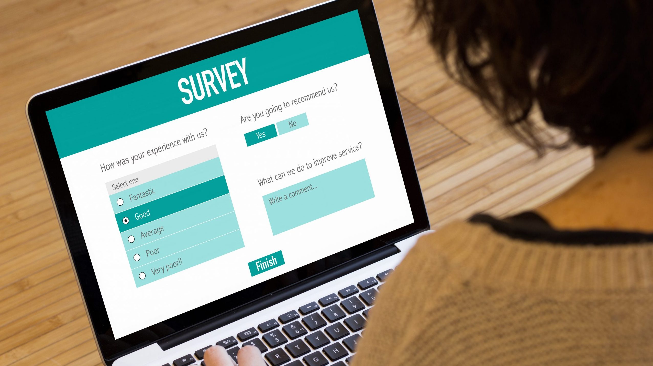 Woman looks at survey on computer screen