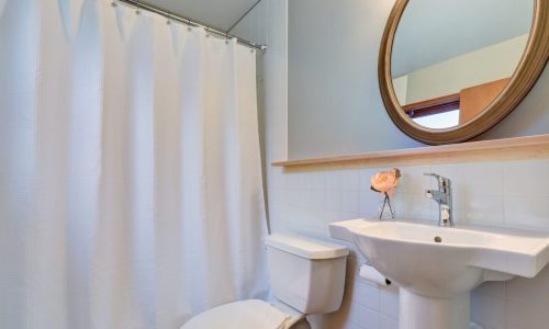 Clean white shower curtain in bathroom