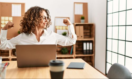 Woman exercises at desk