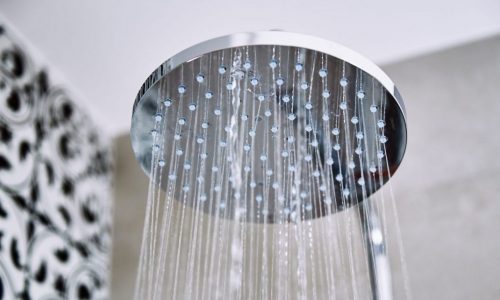 Rain showerhead running with water.