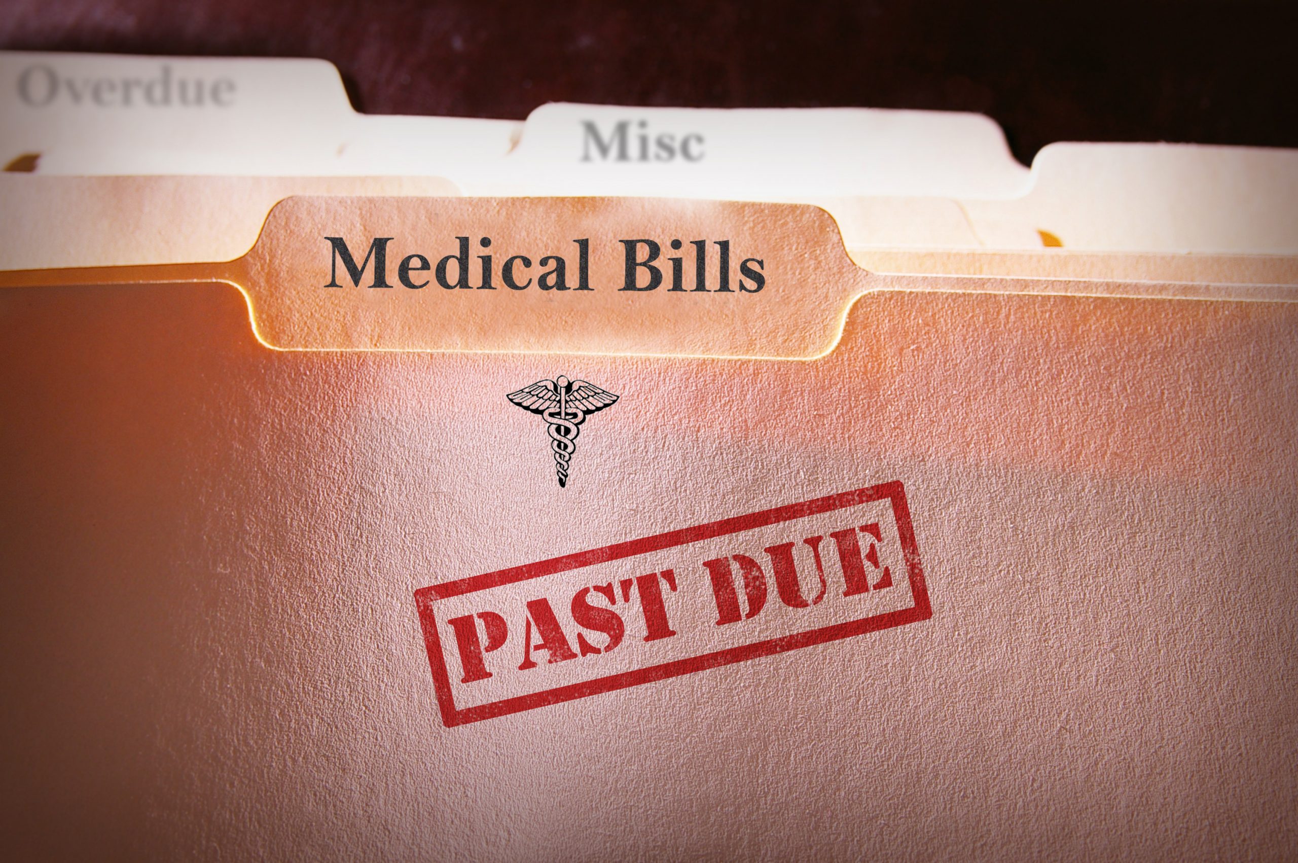 Past due medical bills on folder