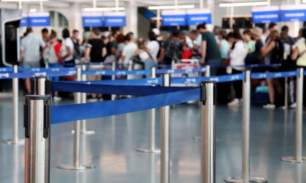 People wait in line at airport customs