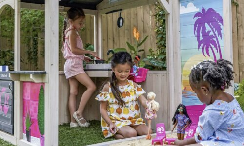 Kids play in Barbie Seaside Playhouse