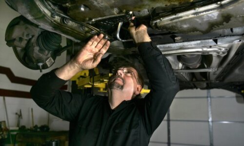 In this Nov. 30, 2007 file photo, mechanic Ed Wuerth of Wuerth Automotive in Brownstown Township, Mich., works on a Volvo at his shop. While new car owners may worry about making monthly payments in the event of a job loss, those that have had their cars for a few years may face concerns about paying for a hefty repair, especially as a vehicle nears the end of its original warranty period.