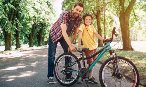 Dad and kid on bikes