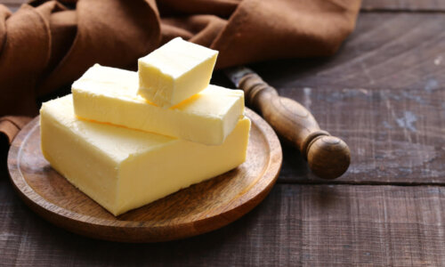 Butter on plate on wooden table