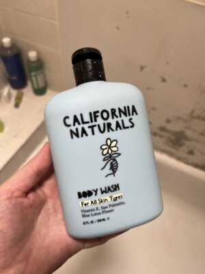 holding bottle of california naturals