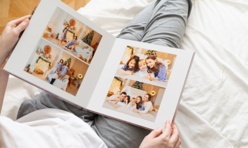 person looks at photo book